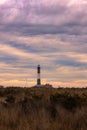 Dramatic colorful stormy sky behind a tall stone lighthouse beacon. Fire Island Royalty Free Stock Photo