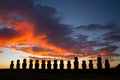 Dramatic colorful sunrise over Moai stone sculptures at Ahu Tongariki, Easter island, Chile.