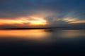 Smooth beach nature landscape bakground at sunrise with morning light over horizon. Royalty Free Stock Photo