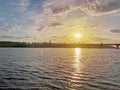 Dramatic colorful sunset over Dnipro river in Kiev, Ukraine. Historical sights of Ukraine. Beautiful scenic view of Kyiv. Sunset Royalty Free Stock Photo