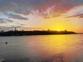 Dramatic colorful sunset over Dnipro river in Kiev, Ukraine. Historical sights of Ukraine. Beautiful scenic view of Kyiv. Sunset Royalty Free Stock Photo