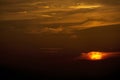 Dramatic colorful sunset sky with clouds over the mountains Royalty Free Stock Photo