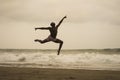 Contemporary dance choreographer doing ballet beach workout . young attractive and athletic black African American man dancing on Royalty Free Stock Photo
