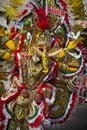 Dramatic costume of parade reveler depicting elephants.