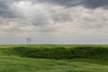 Dramatic countryside landscape with thunderclouds in the sky over a wheat field