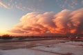 Dramatic crimson clouds over a small town at sunset, beautifully illuminated by golden light