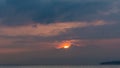 Crimson Sunrise behind Clouds and Alps Mountains and Lake Leman