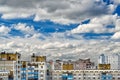 Dramatic cumulonimbus clouds on blue sky over cityscape