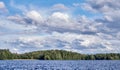 Dramatic cumulus clouds in the bright summer day scene in Finland Royalty Free Stock Photo