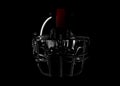 Dark 3D Rendered Football Helmet with Red Stripe Over Black Background and Clipping Path Royalty Free Stock Photo