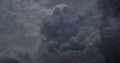 Dramatic dark storm thundercloud rain clouds on black sky background. Dark thunderstorm clouds rainny landscape. Meteorology