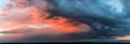 Dramatic dark sunset. Panorama of dark rain clouds in the evening Royalty Free Stock Photo