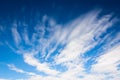 Dramatic deep blue sky with streaky clouds