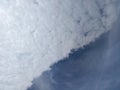 Dramatic Diagonal Sky Background: Half White Clouds, Half Deep Blue Royalty Free Stock Photo