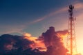 Dramatic dusk sky colorful cloud with communication signal tower silhouette