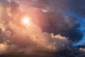 Dramatic epic storm sky with cumulus clouds, orange sun and sunlight, heaven Royalty Free Stock Photo