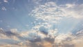 Dramatic evening sky with rays of light. Aerial view of blue sky with clouds. Heaven concept. Sunshine in the sky.