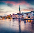 Dramatic evening view of Fraumunster Church. Colorful autumn cityscape of Zurich, Switzerland, Europe. Sunset on Limmat River. Tra