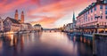 Dramatic evening view of Fraumunster and Grossmunster Churches. Illuminated autumn cityscape of Zurich, Switzerland, Europe. Sunse Royalty Free Stock Photo