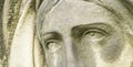 Dramatic eye view of Virgin Mary. Fragment of an ancient stone statue of sad woman in grief Royalty Free Stock Photo