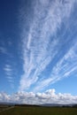 Dramatic feathery white clouds in blue sky Royalty Free Stock Photo