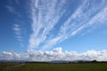 Dramatic feathery white clouds in blue sky Royalty Free Stock Photo