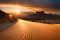 A dramatic, fiery sunset casting long shadows over a desert landscape