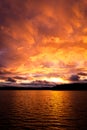 Dramatic fire red sunset over a lake Royalty Free Stock Photo