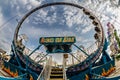 Dramatic fisheye view of looped carnival midway ride