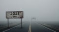 2025 End road sign fades into a foggy 2026 journey Royalty Free Stock Photo