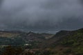Dramatic foggy landscape image of avocado farm in and mountains in the caribbean campo of Ocoa, dominican republic.