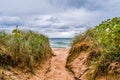 Dramatic footpath towards lake michigan beach