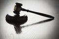 Dramatic Gavel Silhouette on Reflective Wood Royalty Free Stock Photo
