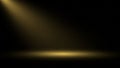 Dramatic golden spotlight illuminating a dark stage or studio floor Royalty Free Stock Photo
