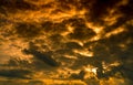 Dramatic golden sunset sky and white cumulus clouds. Cloudy sky. God light concept. Beautiful cloudscape. Peaceful and tranquil Royalty Free Stock Photo