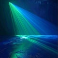 Dramatic Green and Blue Light Beams Illuminating a Textured Surface spotlight illumination Royalty Free Stock Photo