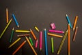 Dramatic group of pencils on black or dark background. Royalty Free Stock Photo