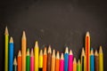 Dramatic group of pencils on black or dark background. Royalty Free Stock Photo