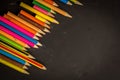 Dramatic group of pencils on black or dark background. Royalty Free Stock Photo