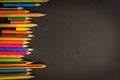 Dramatic group of pencils on black or dark background. Royalty Free Stock Photo