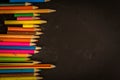 Dramatic group of pencils on black or dark background. Royalty Free Stock Photo