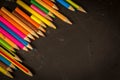 Dramatic group of pencils on black or dark background. Royalty Free Stock Photo