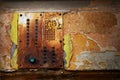 Dramatic grunge old wall with intercom panel buttons, background Royalty Free Stock Photo