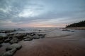 dramatic high contrast clouds in sunset over seaside beach