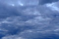 Dramatic high deep blue sky with fluffy clouds, cloudscape in stormy weather, overcast day atmosphere before the storm Royalty Free Stock Photo