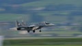 Dramatic image of military fighter jet aircraft flying at low altitude. Panning Royalty Free Stock Photo