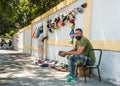 Dramatic image of street vender selling shoes in mountains of the dominican republic.