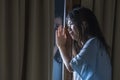 Dramatic portrait of young sad and depressed Asian Japanese woman crying desperate broken heart suffering depression and anxiety Royalty Free Stock Photo