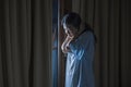 Dramatic portrait of young sad and depressed Asian Japanese woman crying desperate broken heart suffering depression and anxiety Royalty Free Stock Photo