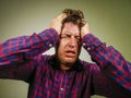 Dramatic isolated portrait of young desperate and stressed man suffering anxiety crisis and depression problem screaming Royalty Free Stock Photo